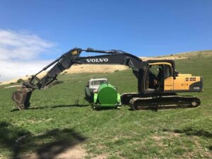Volvo excavator performing earthworks on a rural Canterbury property